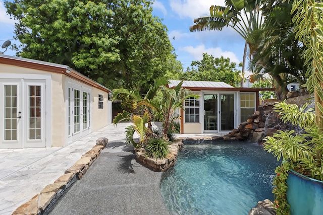 215 Whitehead St, Key West, FL 33040 - swimming pool with french doors, a patio area, an exterior structure, and an outbuilding