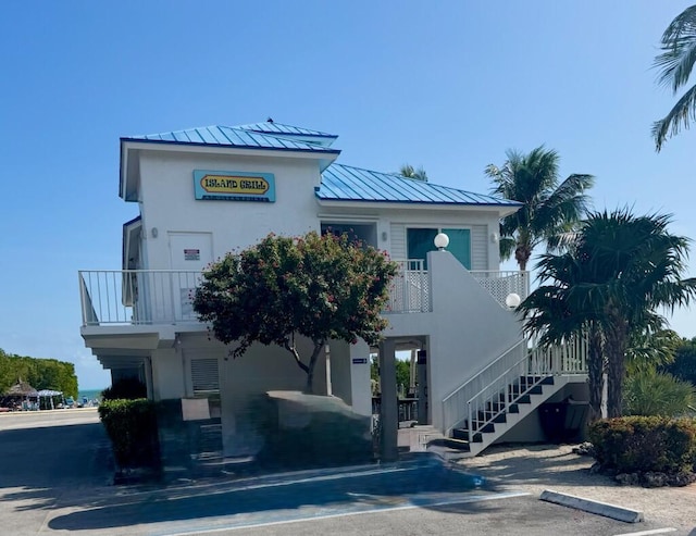 view of property featuring stairs