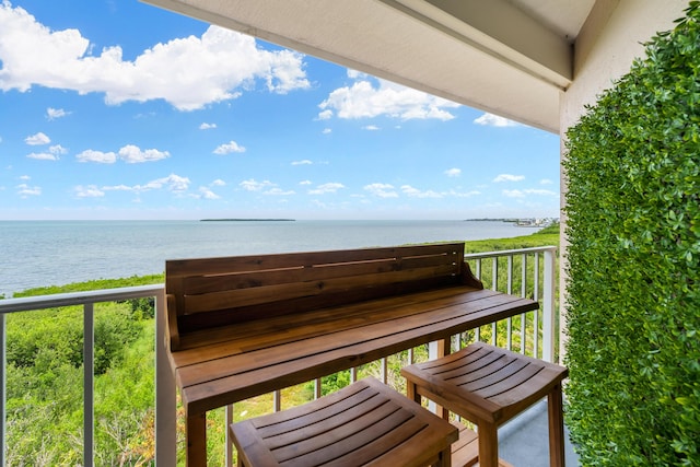 balcony featuring a water view