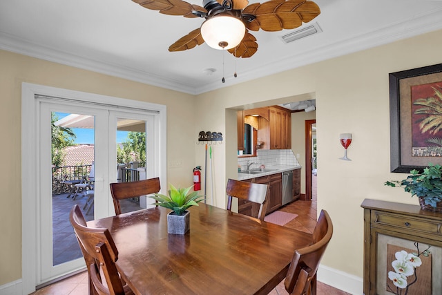 dining space featuring light tile patterned flooring, sink, ornamental molding, ceiling fan, and french doors