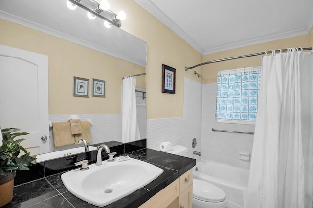 full bathroom with toilet, crown molding, tile walls, vanity, and shower / bath combo