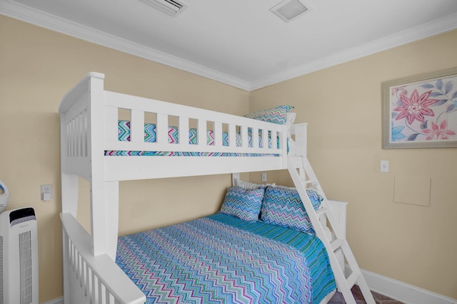 bedroom with crown molding