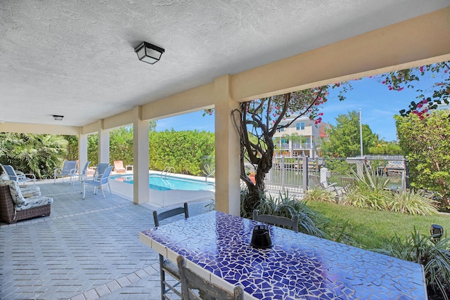 view of patio with a fenced in pool