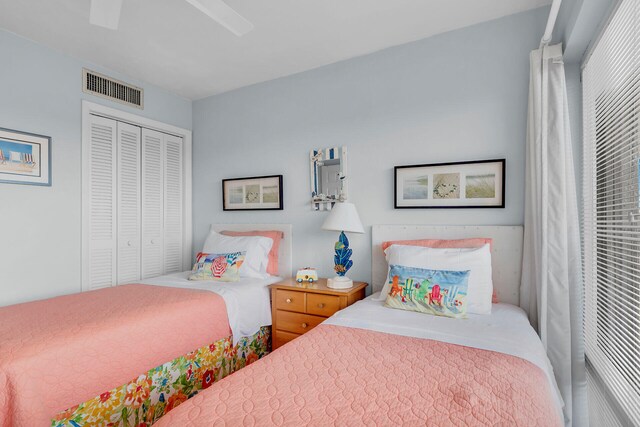 bedroom featuring ceiling fan and a closet