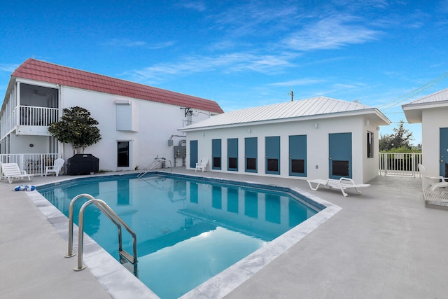 view of swimming pool with a patio