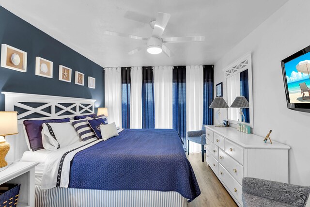 bedroom featuring ceiling fan and light hardwood / wood-style floors