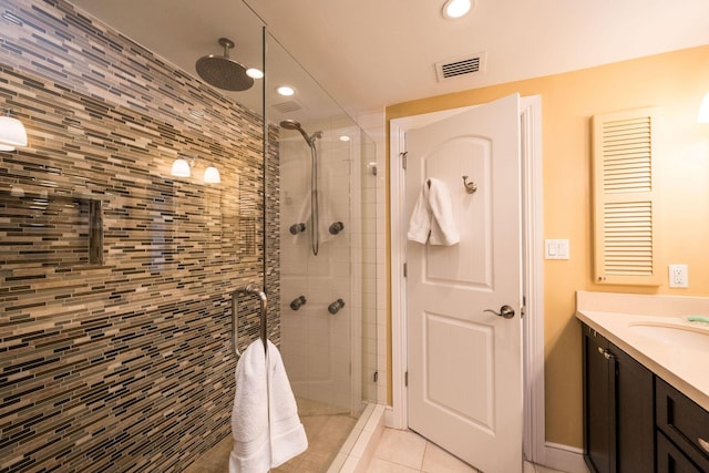 105 Front St Unit 121, Key West, FL 33040 - bathroom featuring tile patterned flooring, vanity, recessed lighting, visible vents, and a stall shower