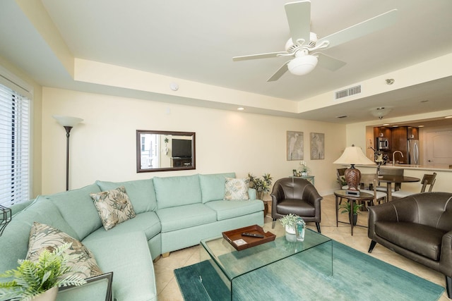 105 Front St Unit 121, Key West, FL 33040 - living area featuring visible vents, a ceiling fan, a raised ceiling, and light tile patterned flooring