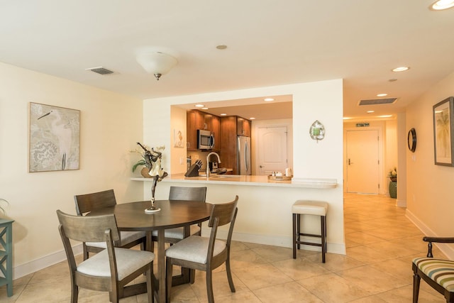 105 Front St Unit 121, Key West, FL 33040 - dining area with visible vents, recessed lighting, baseboards, and light tile patterned flooring