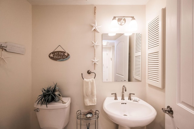 105 Front St Unit 121, Key West, FL 33040 - half bath featuring a sink and toilet