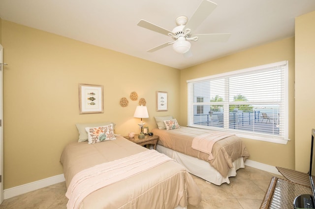 105 Front St Unit 121, Key West, FL 33040 - bedroom featuring a ceiling fan, baseboards, and light tile patterned floors
