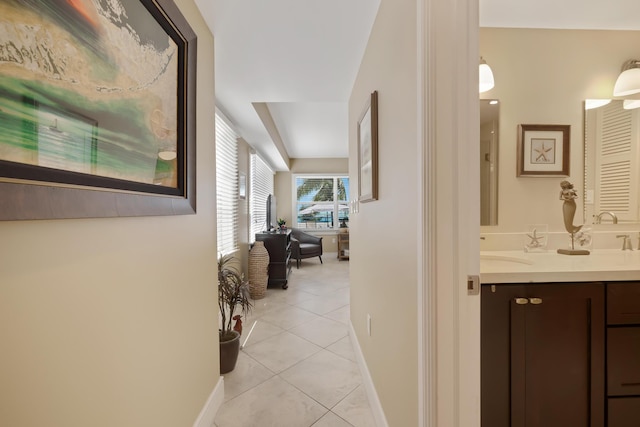 105 Front St Unit 121, Key West, FL 33040 - hall with baseboards and light tile patterned floors