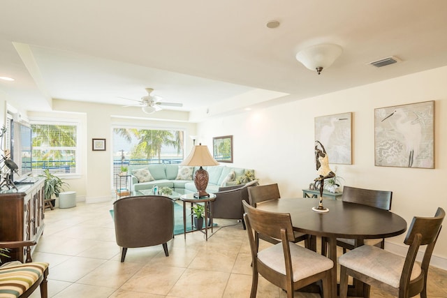 105 Front St Unit 121, Key West, FL 33040 - dining area featuring light tile patterned floors, a tray ceiling, visible vents, and ceiling fan