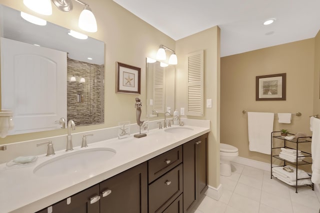 105 Front St Unit 121, Key West, FL 33040 - full bathroom featuring double vanity, a sink, tile patterned flooring, and a stall shower