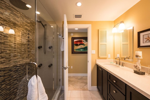 105 Front St Unit 121, Key West, FL 33040 - bathroom with visible vents, tile patterned flooring, vanity, baseboards, and a stall shower