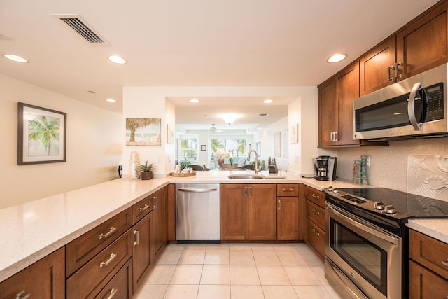 105 Front St Unit 121, Key West, FL 33040 - kitchen with visible vents, appliances with stainless steel finishes, a sink, light countertops, and recessed lighting