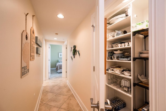 105 Front St Unit 121, Key West, FL 33040 - corridor with recessed lighting, baseboards, and light tile patterned floors