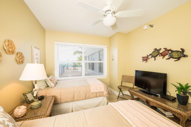 105 Front St Unit 121, Key West, FL 33040 - bedroom with a ceiling fan and baseboards