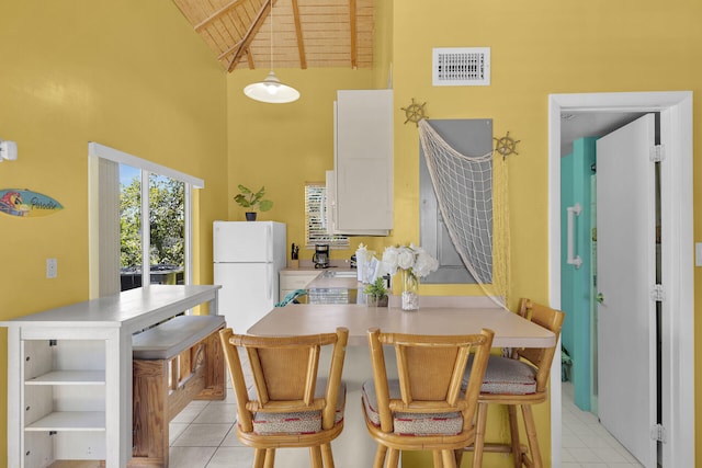 kitchen with visible vents, high vaulted ceiling, open shelves, light tile patterned flooring, and wooden ceiling