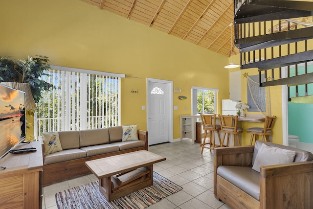 living room featuring beam ceiling, high vaulted ceiling, wooden ceiling, light tile patterned floors, and baseboards