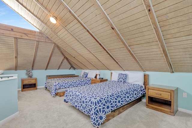 carpeted bedroom featuring baseboards and vaulted ceiling