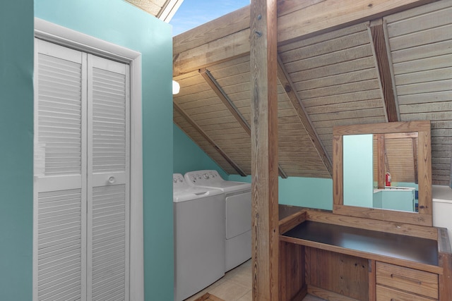 laundry room with tile patterned floors, independent washer and dryer, and laundry area