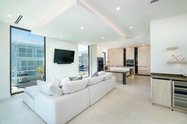 94825 Overseas Hwy Unit 174, Key Largo, FL 33037 - living area featuring a wall of windows, wine cooler, bar area, and recessed lighting