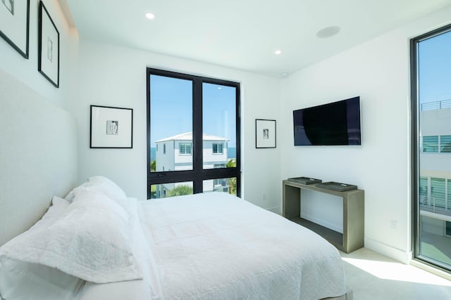 94825 Overseas Hwy Unit 174, Key Largo, FL 33037 - carpeted bedroom with multiple windows and recessed lighting
