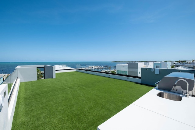 94825 Overseas Hwy Unit 174, Key Largo, FL 33037 - view of green lawn featuring a water view, a sink, and a balcony