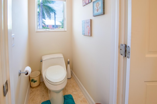 bathroom featuring tile patterned flooring and toilet