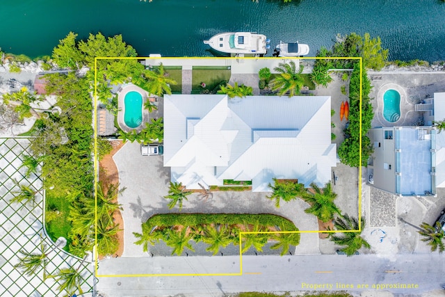 birds eye view of property featuring a water view