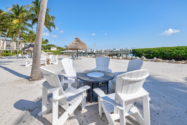 view of patio featuring a gazebo and a water view