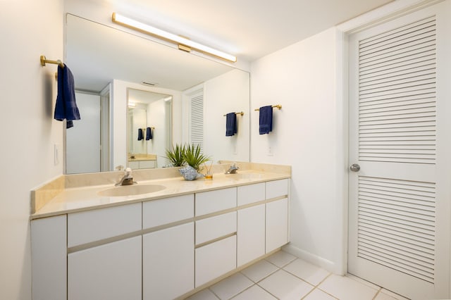 bathroom featuring tile patterned flooring and vanity