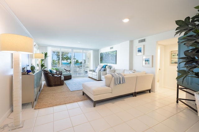 tiled living room featuring expansive windows and ornamental molding