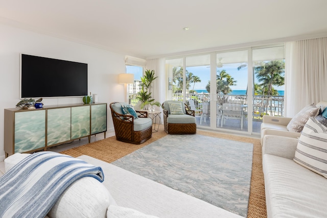 living room with expansive windows and a water view