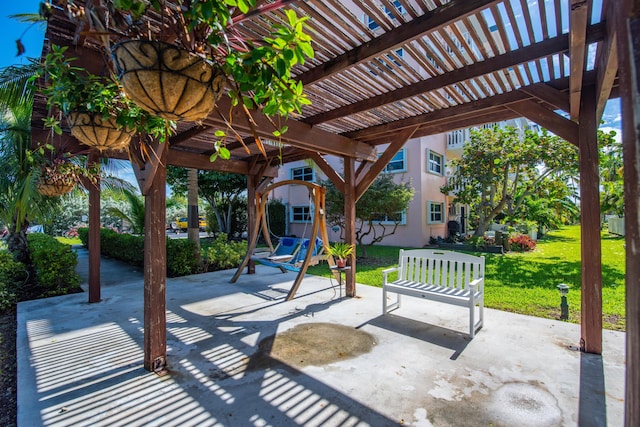 view of patio featuring a pergola and a playground