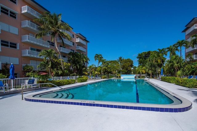 view of swimming pool with a patio area