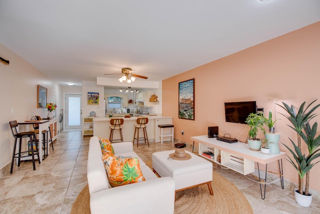 living room featuring light tile patterned flooring and ceiling fan