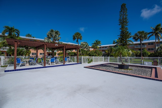 view of property's community with a patio area