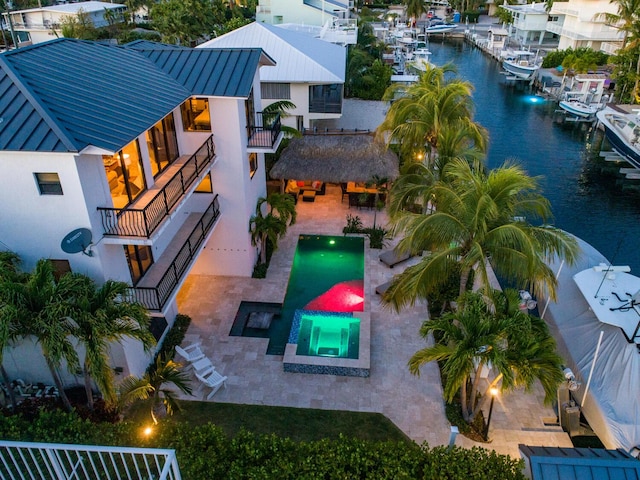 birds eye view of property featuring a water view