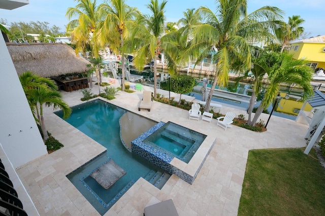 view of swimming pool with an in ground hot tub, an outdoor bar, and a patio