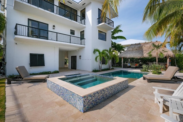 view of swimming pool featuring a gazebo, a patio area, and an in ground hot tub