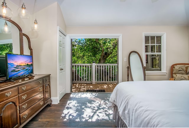 bedroom with dark hardwood / wood-style flooring and access to outside