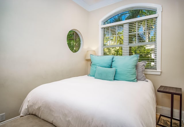 bedroom featuring ornamental molding