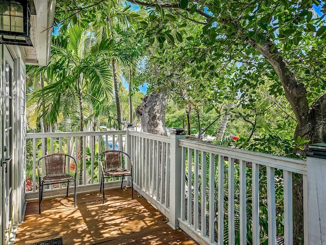 wooden balcony featuring a deck