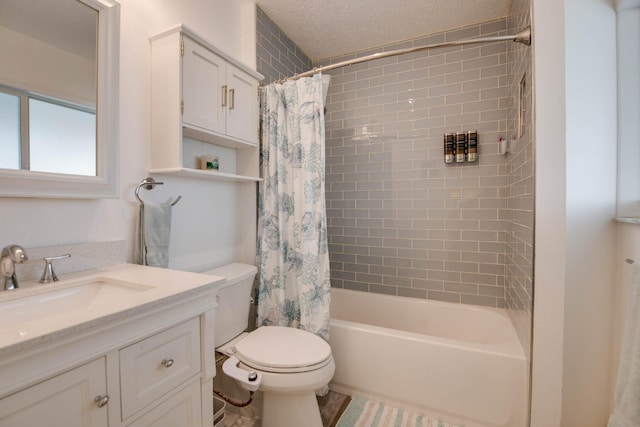 full bathroom featuring vanity, toilet, a textured ceiling, and shower / bath combo with shower curtain