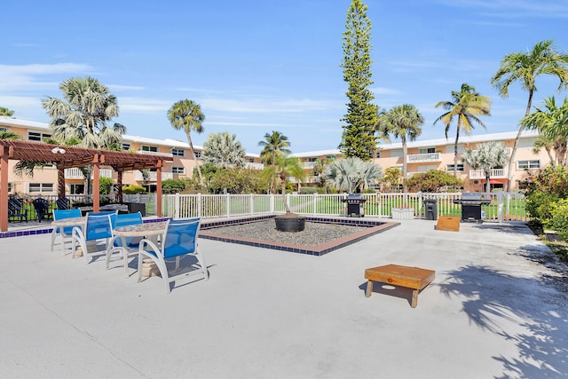 view of community with a patio and a pergola