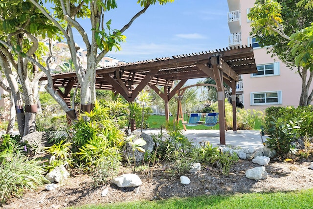 view of yard with a pergola and a patio area