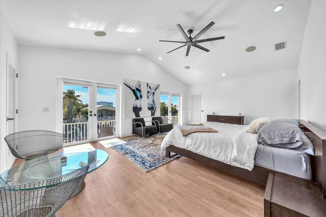 bedroom with french doors, high vaulted ceiling, light hardwood / wood-style floors, and access to outside