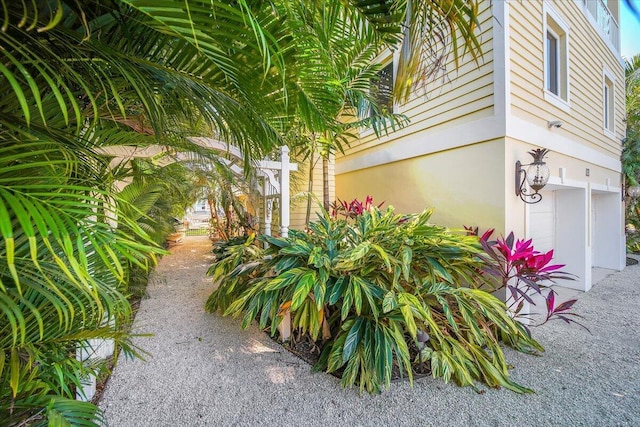 view of property exterior with a garage